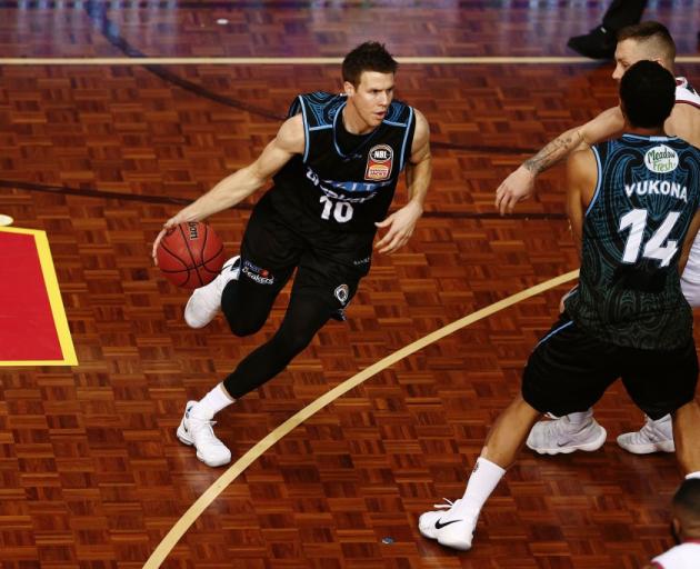 Tom Abercrombie comes off a screen set by Mika Vukona in the Breakers win over the 36ers. Photo:...