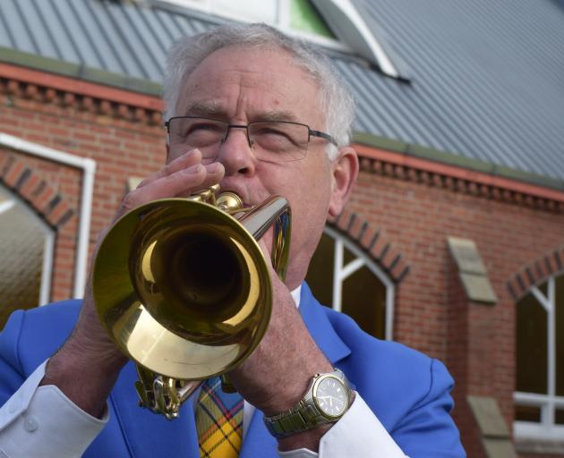 Mosgiel Brass Band musical director Phil Craigie, pictured playing the cornet, says players are...
