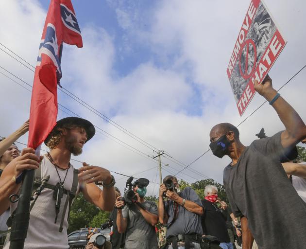 Protesters face off across the ideological divide in Georgia, US. Photo: TNS