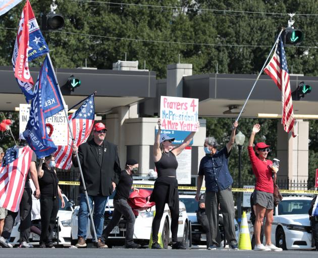 Supporters rally for resident Donald Trump outside of the Walter Reed National Military Medical...