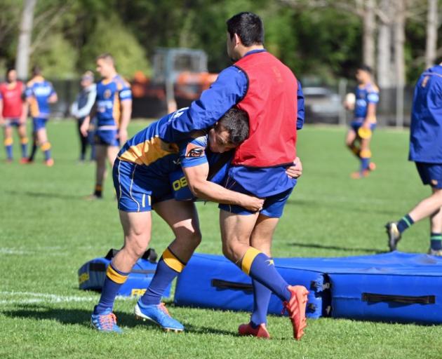 Aleki Morris tackles Sio Tomkinson during Otago training at Logan Park yesterday. Photo: Getty...