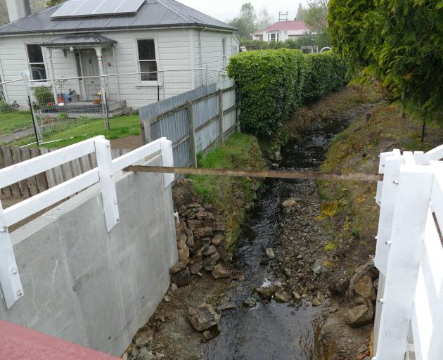 A new culvert channelling the flood-prone Hospital Creek runs beneath Campbelton St in Lawrence. 