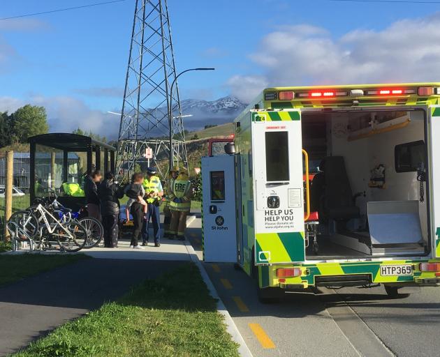 Police speak to witnesses after a child was hit by a car in Shotover Country this morning. Photo: Guy Williams