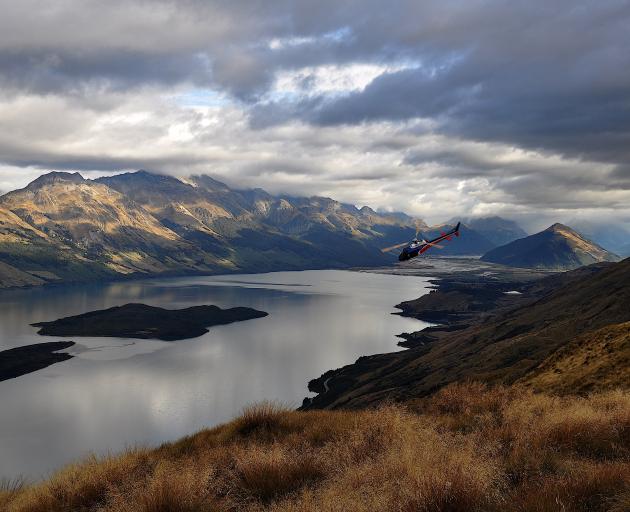 Hamish McKerchar pilots a helicopter over Queenstown and Milford. PHOTO: SUPPLIED