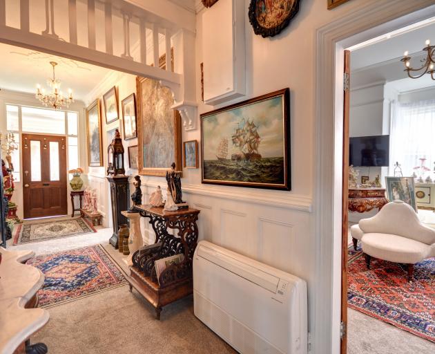 Paintings line the hall.