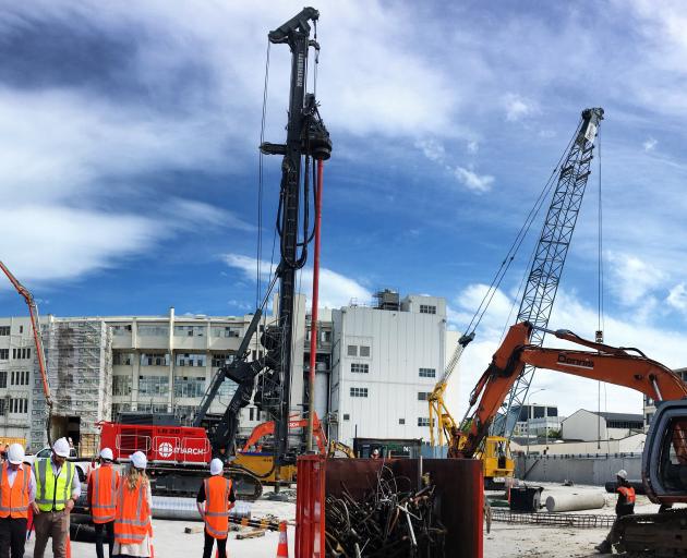 March Construction workers prepare for a test pile to be drilled at the new Dunedin Hospital site...