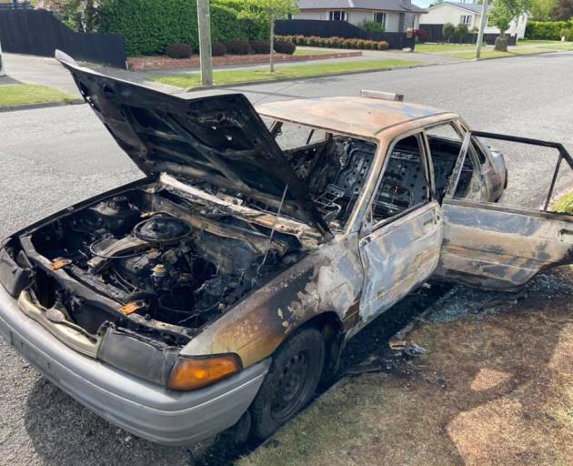 James Withington's car was pushed along the street and set alight. ​Photo: Supplied