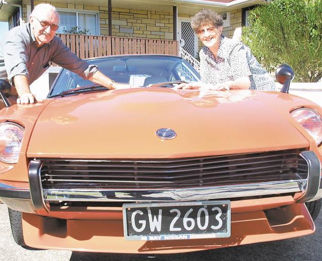Kevin and Maureen Gallagher featured in the Bay of Plenty Times in 2002 after winning the glinting red and chrome 1973 Datsun 240Z. Photo / File Kevin and Maureen Gallagher featured in the Bay of Plenty Times in 2002 after winning the glinting red and chrome 1973 Datsun 240Z. Photo / File