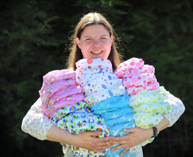 Kelly Sweeney with some of the nappies her now 10-year-old business sells from Sawyers Bay in...