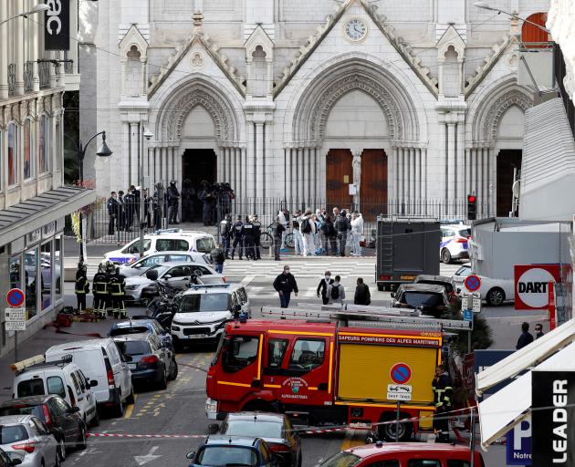 Security forces guard the area after a reported knife attack at Notre Dame church in Nice, France...