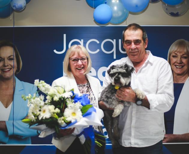 Returning Waitaki MP Jacqui Dean celebrates her win with husband Bill and Jimmy the dog in Oamaru...