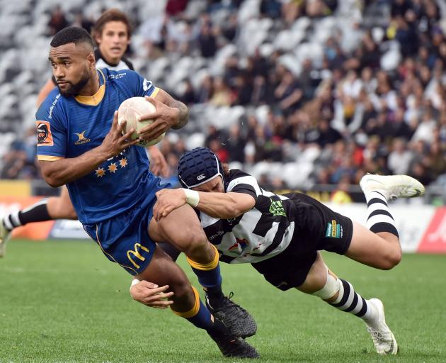Otago winger Joan Nareki is tackled by Hawke’s Bay replacement back Caleb Makene during the...