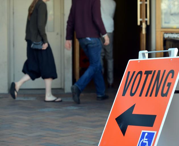 People head for polling booths to cast their vote in Dunedin this morning. Photo by Peter McIntosh