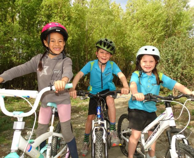 About to tackle a new bike trail on the Shotover River delta are (from left) Esther Nai (6),...