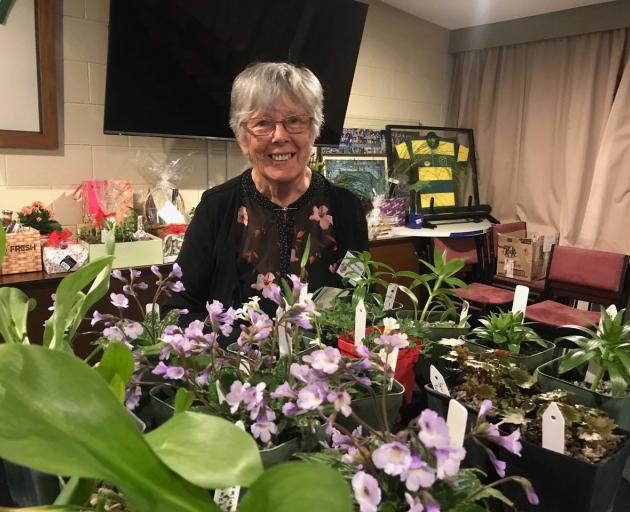 Marcelle Garden, of Roxburgh, behind her well-stocked sales table at the New Zealand Trillium...