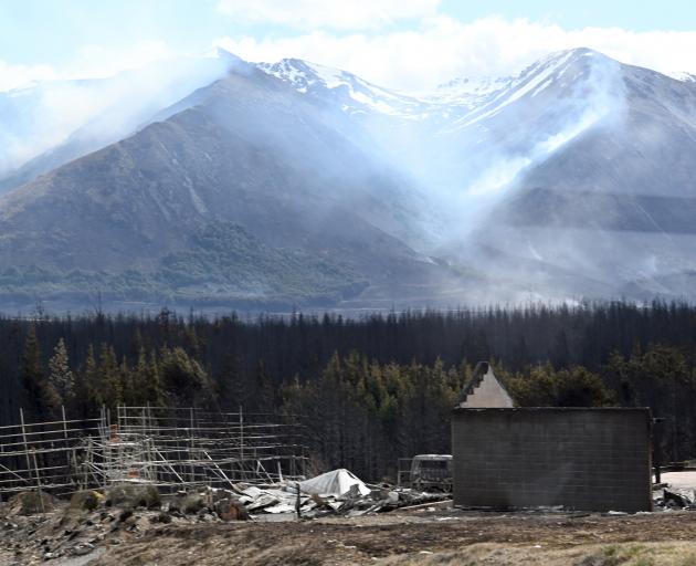 Smoke drifts across the Ohau area yesterday afternoon as the fire continues to burn. PHOTOS:...