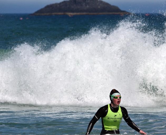 Emma Christophers is first home in the swimming section. PHOTOS: GERARD O’BRIEN