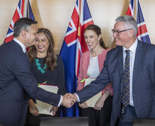 Greens co-leaders James Shaw and Marama Davidson and Labour leader Jacinda Ardern and deputy...