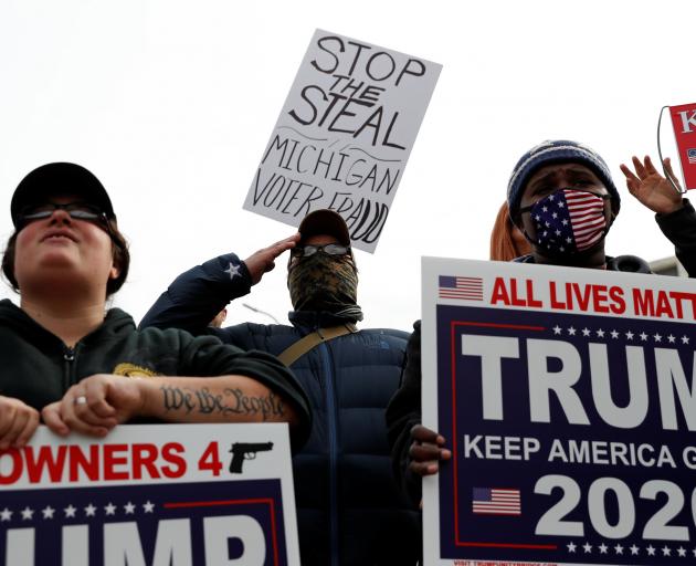 Supporters of Donald Trump rally as votes continue to be counted in Detroit, Michigan. Photo:...