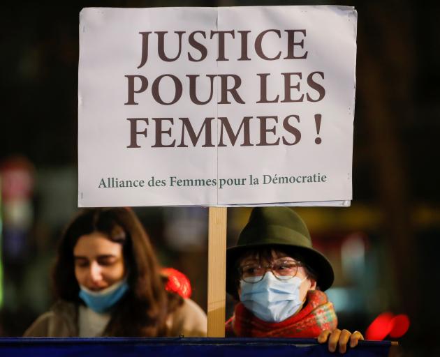 Women attend a gathering to protest femicides and violence against women in Paris. Photo: Reuters 