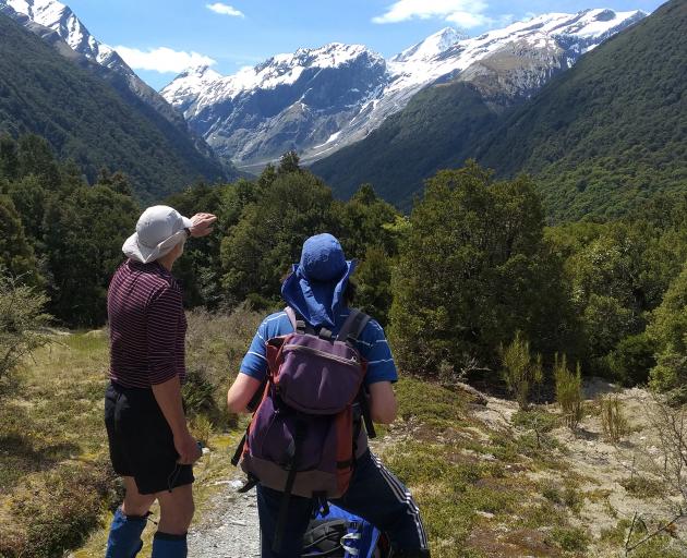 Graham Batchelor and friend Caroline Thomson at Shovel Flat beneath Mt Aspiring and the Breakaway...