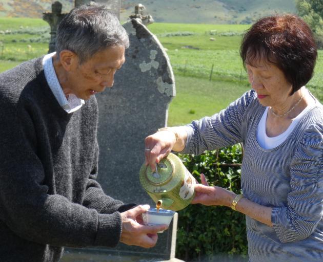 Leslie and Maisie Wong, of Dunedin, perform a Chinese spiritual blessing and prayer at Drybread...