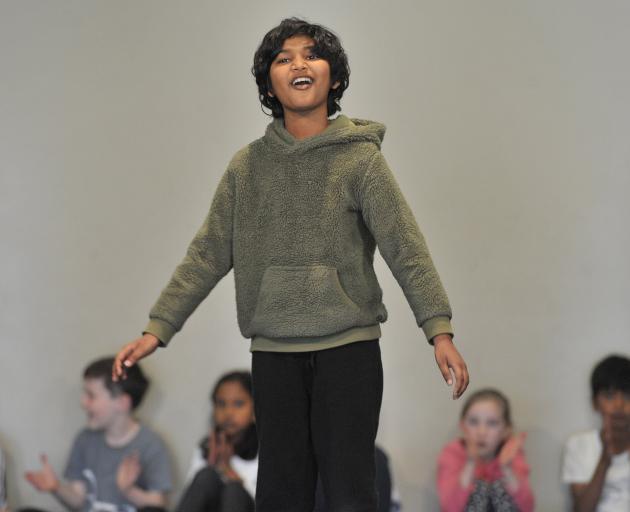 George Street Normal School pupil Aman is dumbfounded at a school assembly yesterday, when it was...