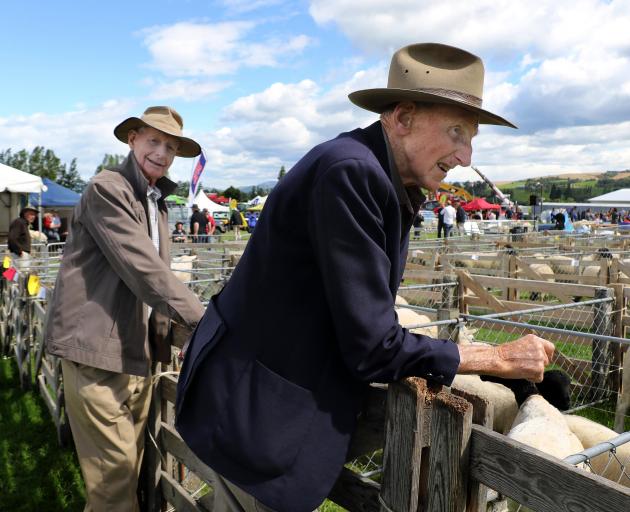 Brothers John (left) and Tom Falconer, of Gore, inspect the offerings at the show.