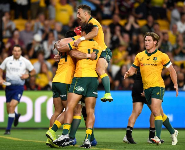 Wallabies players celebrate a Tom Wright try during the 2020 Tri-Nations match against the All Blacks. Photo: Getty Images