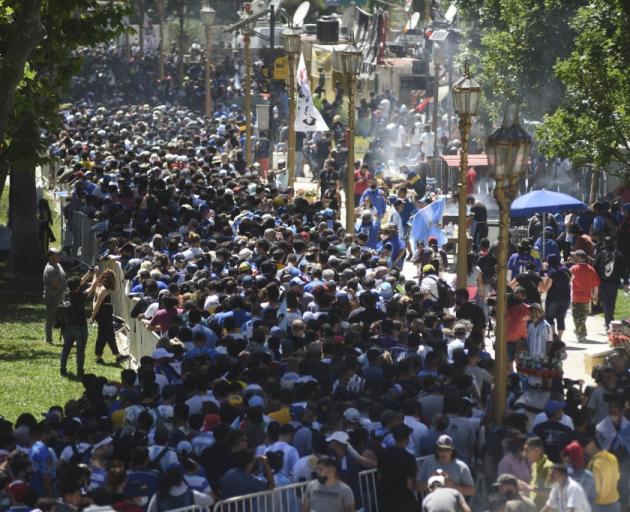 People flocked to the streets of Buenos Aires to mourn the death of Diego Maradona. Photo: Getty...