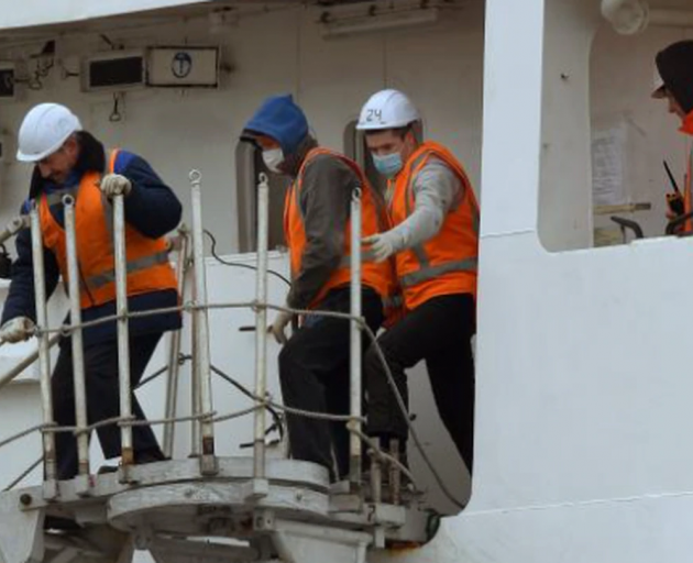 Sailors prepare the Te Raukura for departure in Dunedin yesterday. Photo: Stephen Jaquiery