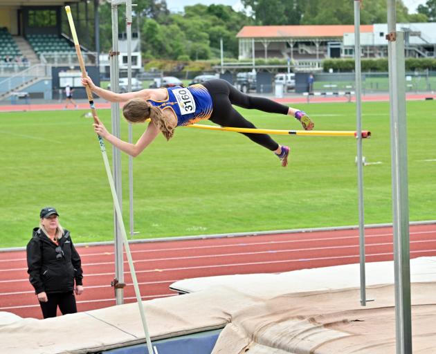 Taieri athlete Gabi Horo (16) nudges the bar during the pole vault at an Athletics Otago meeting...