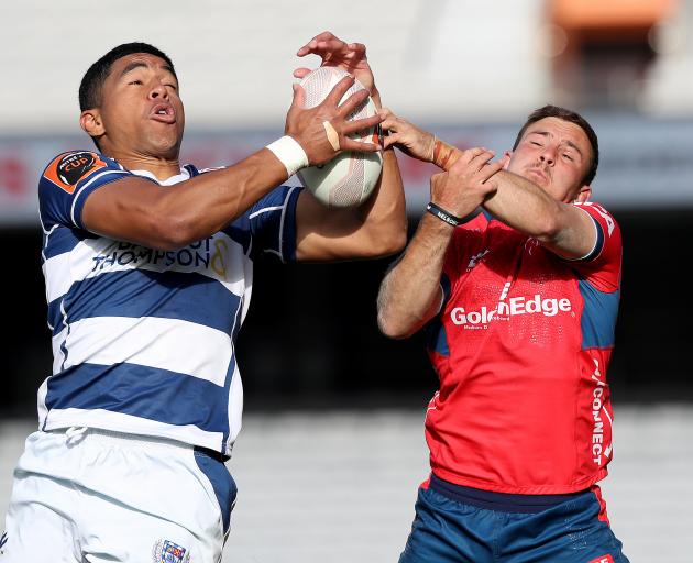 Auckland's Salesi Rayasi and Tasman's Mitchell Hunt go for a high ball. Photo: Getty Images