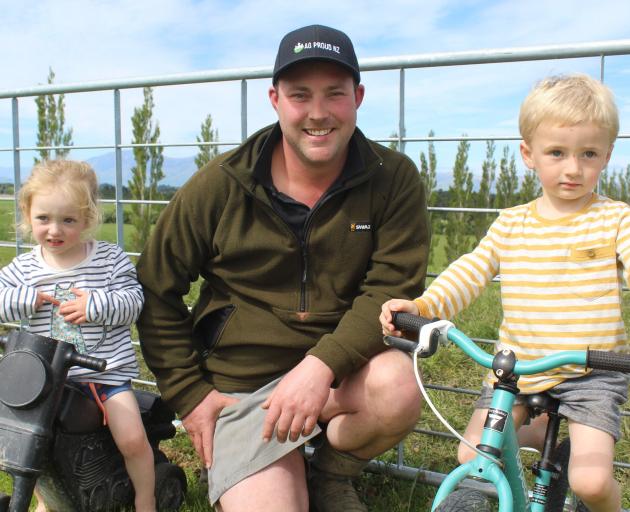 Mossburn dairy farmer and AG Proud founder Jason Checketts with his children Adelaide (2) and Liam (3). Photo: Abbey Palmer