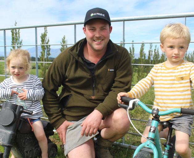 Mossburn dairy farmer and AG Proud founder Jason Checketts with his children Adelaide (2) and Liam (3). Photo: Abbey Palmer Mossburn dairy farmer and AG Proud founder Jason Checketts with his children Adelaide (2) and Liam (3). Photo: Abbey Palmer