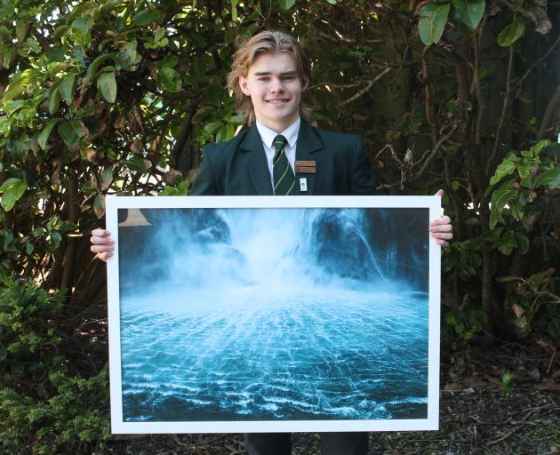 Aparima College pupil Dom Riddell displays one of the photographs he took at Milford Sound. PHOTO...