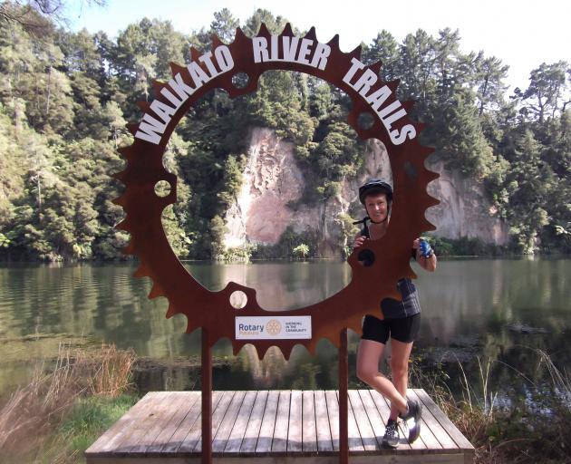 A quick stop at the Waikato River Trails sign at Lake Karapiro.