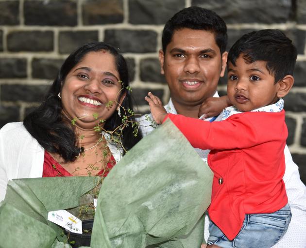Holding her new kowhai tree, new New Zealander Sanumol Antony (left), with her husband Noby...