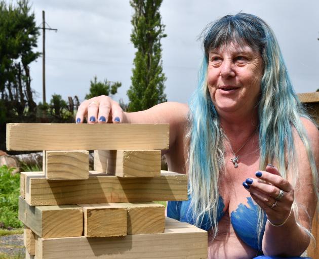 Southern Naturally member Wilma Kremer had a go with the giant Jenga during a break in the rain....