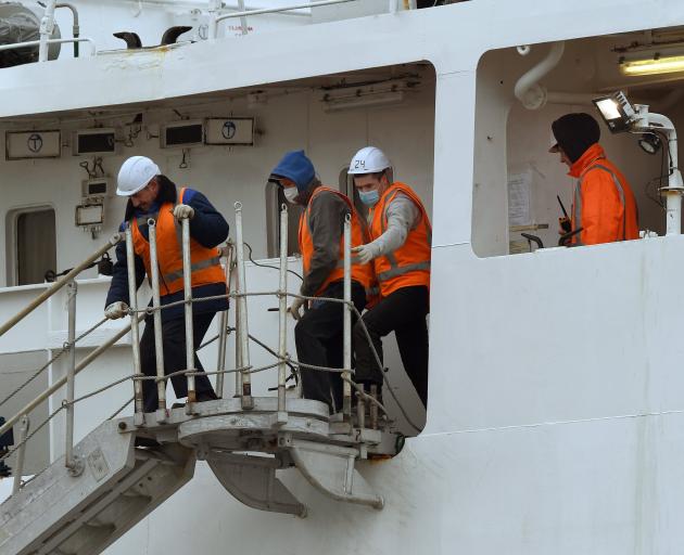 Sailors prepare the Te Raukura for departure in Dunedin yesterday. PHOTO: STEPHEN JAQUIERY