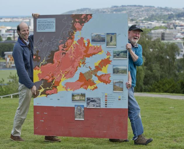 Marco Brenna (left) and Mike Palin, of the University of Otago geology department, with a map...