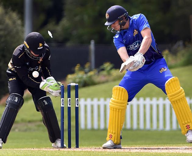 Otago Volts batsman Mitch Renwick is bowled by Malcolm Nofal under the eyes of Wellington...