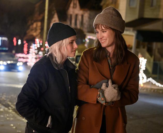 Kristen Stewart (left) and Mackenzie Davis star in the recently released movie Happiest Season....