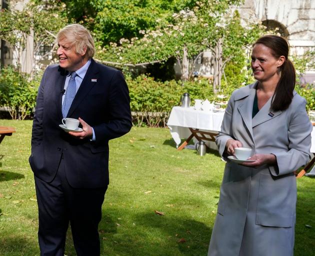 British Prime Minister Boris Johnson shares a joke with nurse Jenny McGee, of Invercargill, at 10...