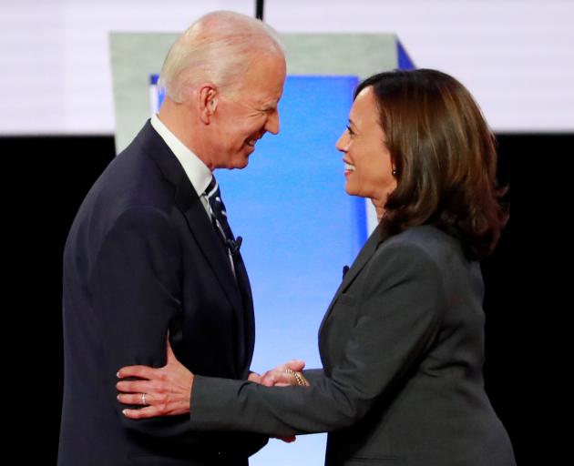 Former Vice President Biden and Senator Harris shake hands before the start of the second night of the second U.S. 2020 presidential Democratic candidates debate in Detroit. Photo: Reuters