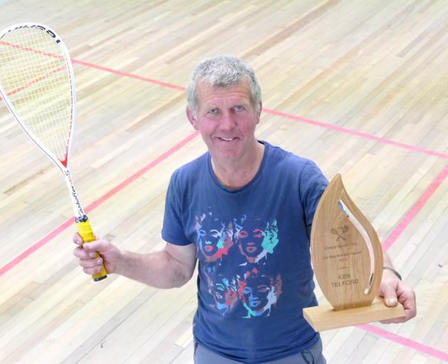 The Clinton Squash Club’s first life member, Ken Telford, shows off his trophy at the club’s...