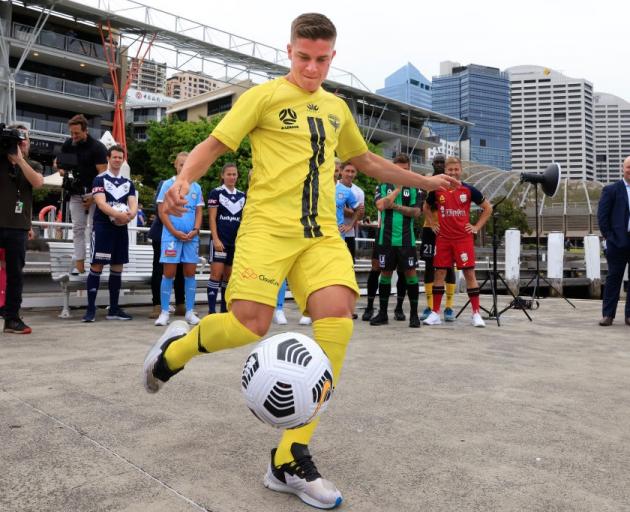 The Wellington Phoenix's Cameron Devlin kicks a ball at the A League's season launch at Darling...