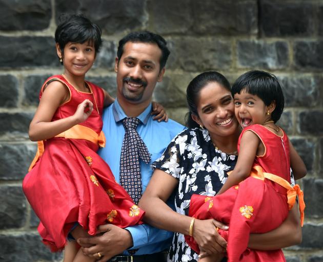 Santhosh Kunnumpurath Jose (37, left) and Merlin Mathew (35), of India, celebrate joining their...