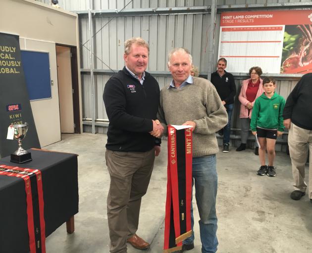 Ashburton farmer Paul Gardner (right) is congratulated by South Pacific Meats' South Island...