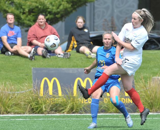 WaiBOP’s Maddison Ollington kicks ahead as Southern United’s Renee Bacon watches during their...